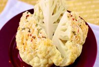 Crispy Whole Roasted Cauliflower with Melted Cheese Glaze