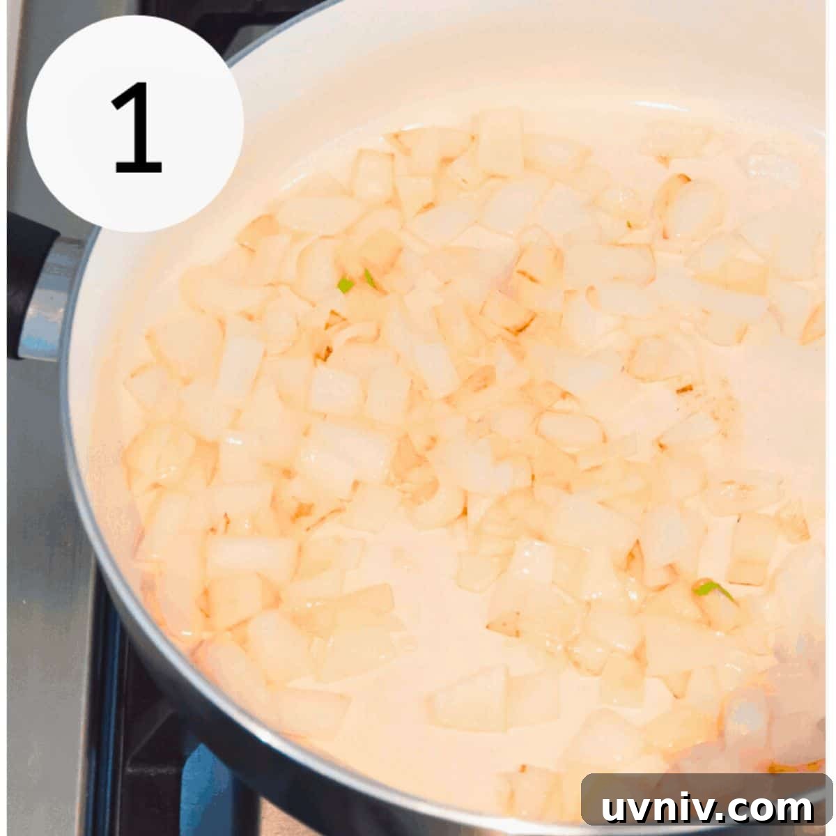 Spanish Cauliflower Rice with Shrimp — Quick Low-Carb Recipe 4 Chopped onions cooking in a pan on the stovetop.
