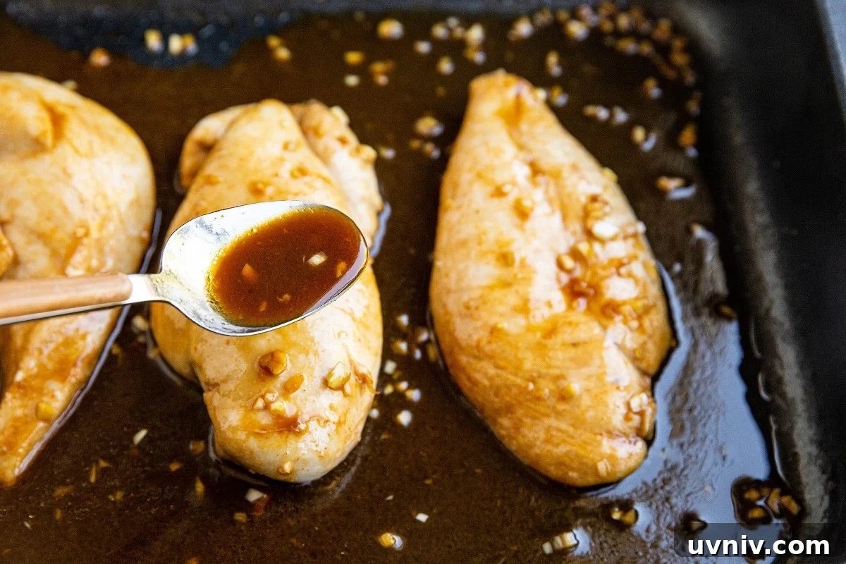 Peruvian Roast Chicken with Aji Verde Green Sauce Recipe 7 Spooning the marinade over the cooked chicken to baste