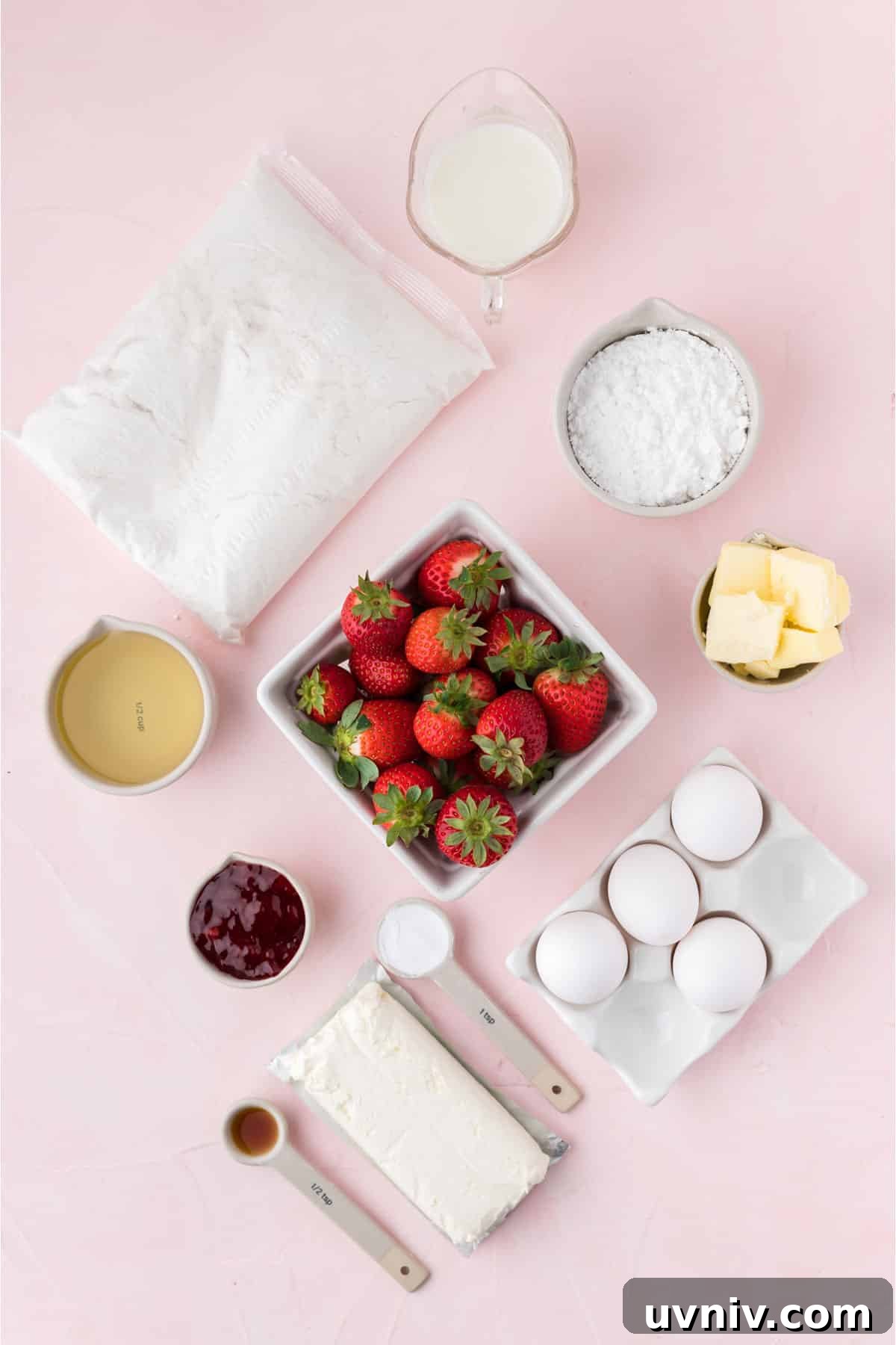 Ingredients to make strawberry cupcakes on the table.