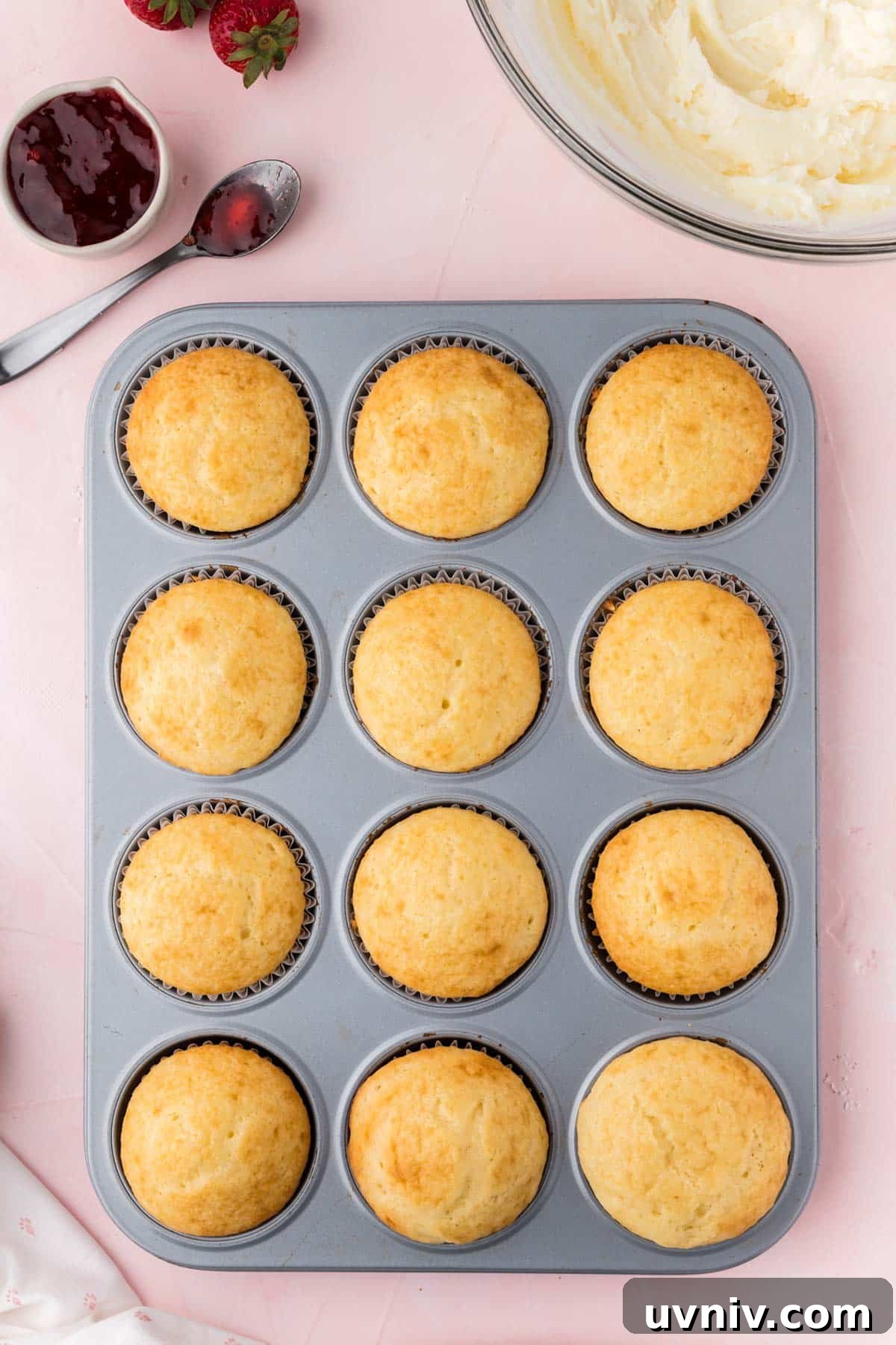 Baked cupcakes in a pan ready to decorate.