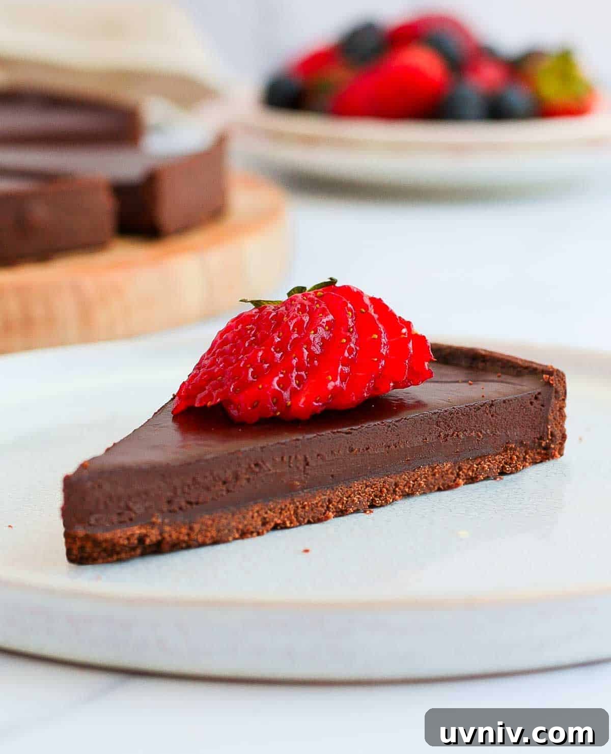 French Chocolate Ganache Tart Recipe: Rich, Silky Dessert Guide 4 One slice of tart on a white plate.