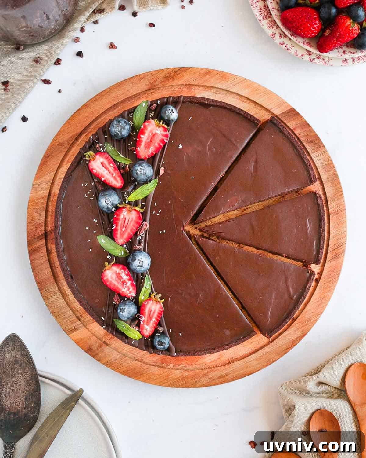 French Chocolate Ganache Tart Recipe: Rich, Silky Dessert Guide 8 Flatlay photo of the tart with 3 slices cut off.