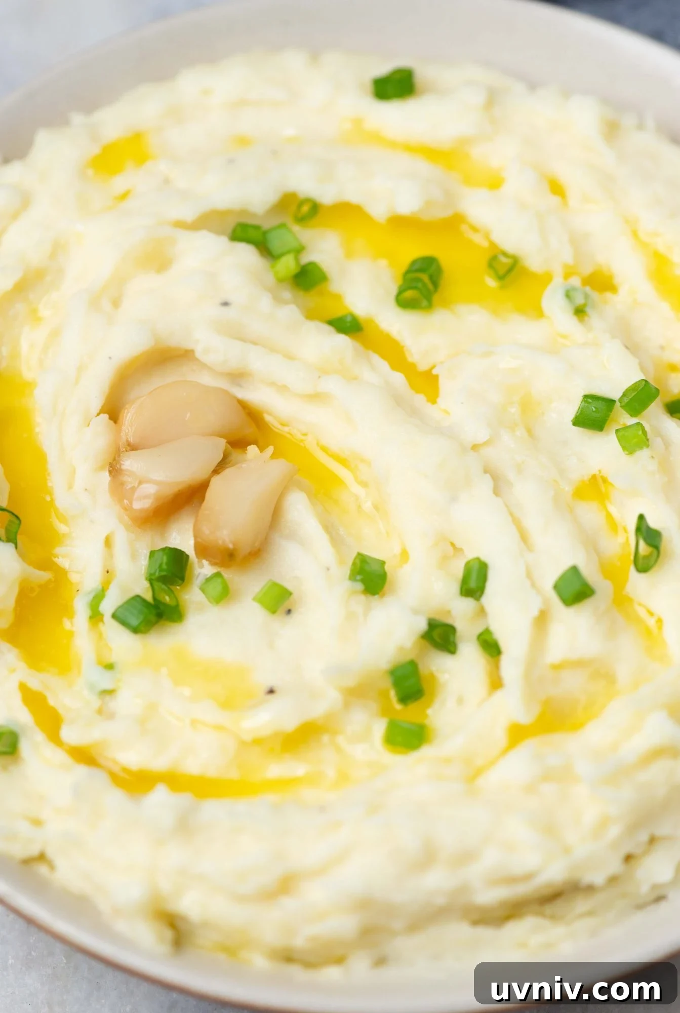 mashed potato elevates everyday mash with the flavor of roasted garlic to a divine side dish to any meat.