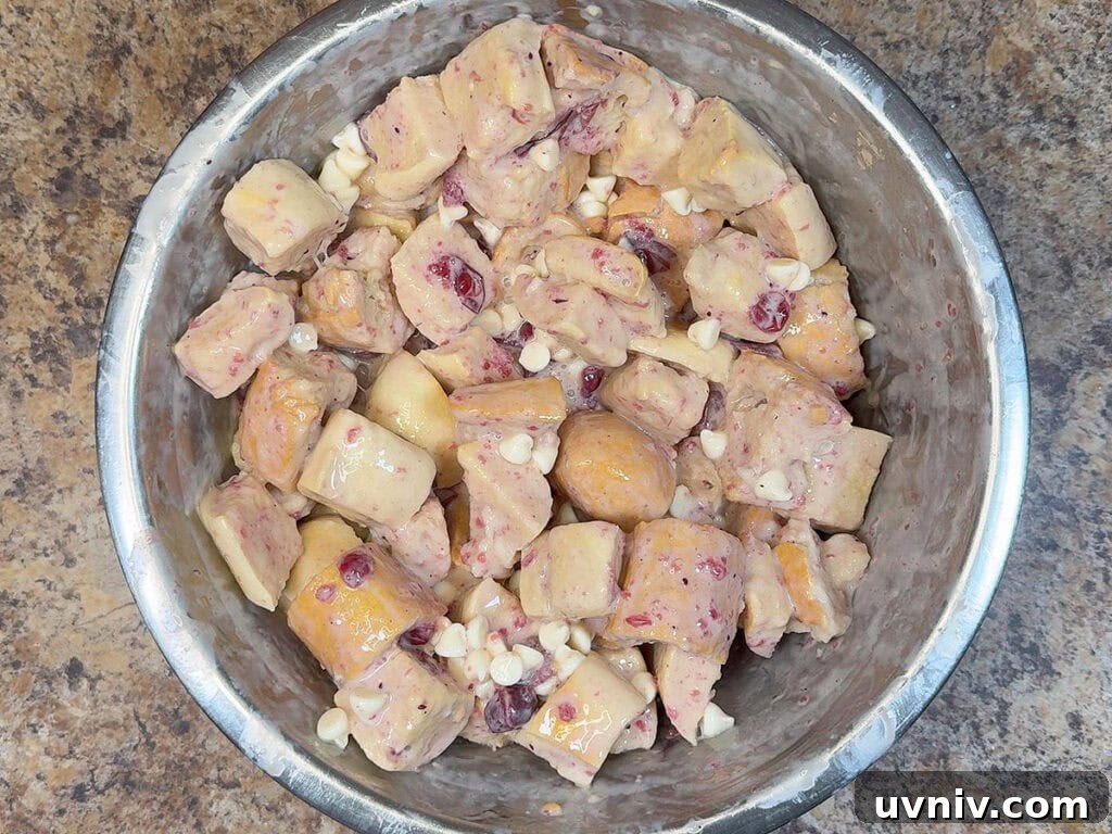 White Chocolate Cranberry Bread Pudding Recipe for Holidays 6 French bread cubes coated with the cream mixture.