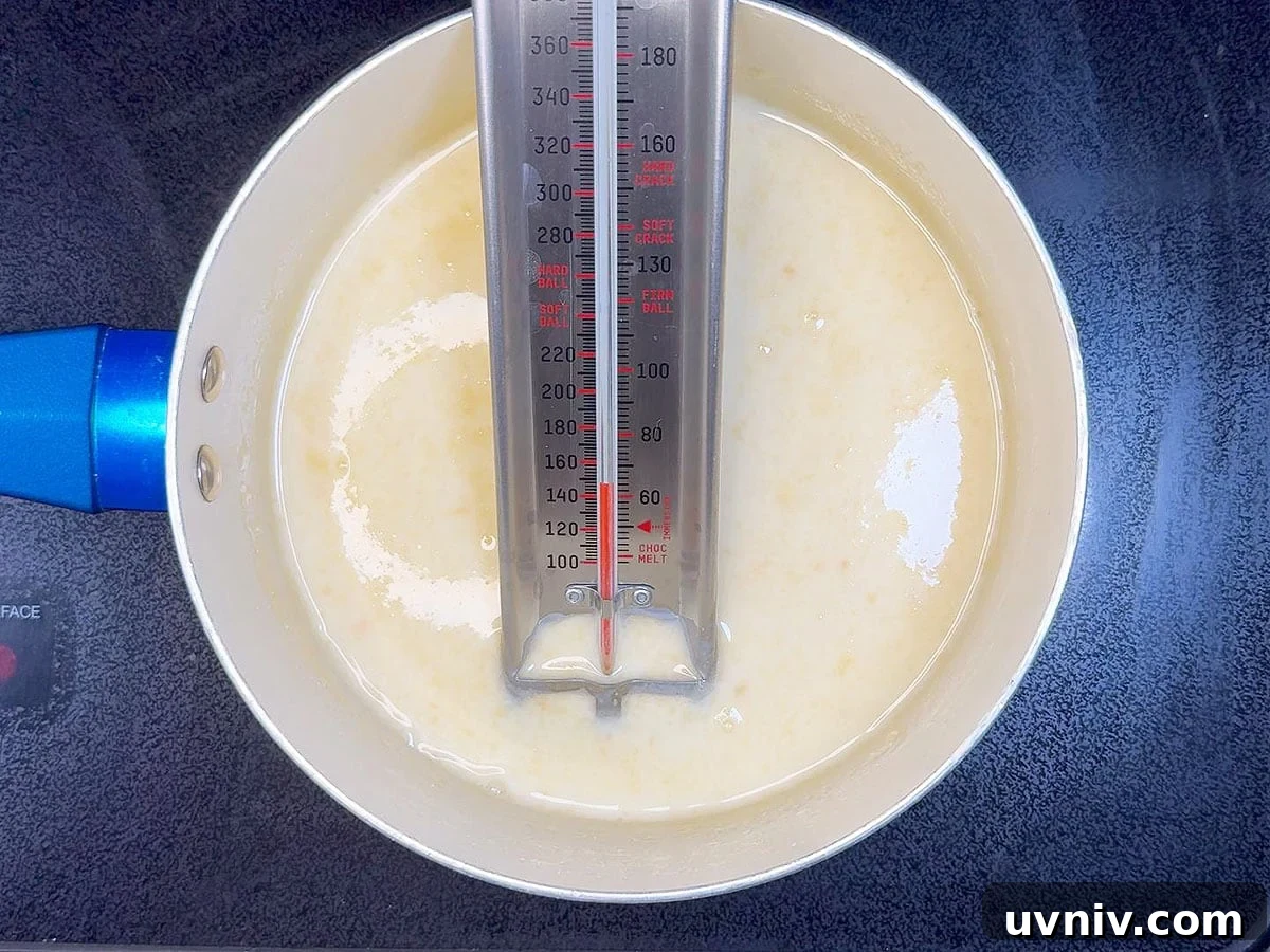 White Chocolate Cranberry Bread Pudding Recipe for Holidays 10 Heating the heavy cream to 140 degrees F.