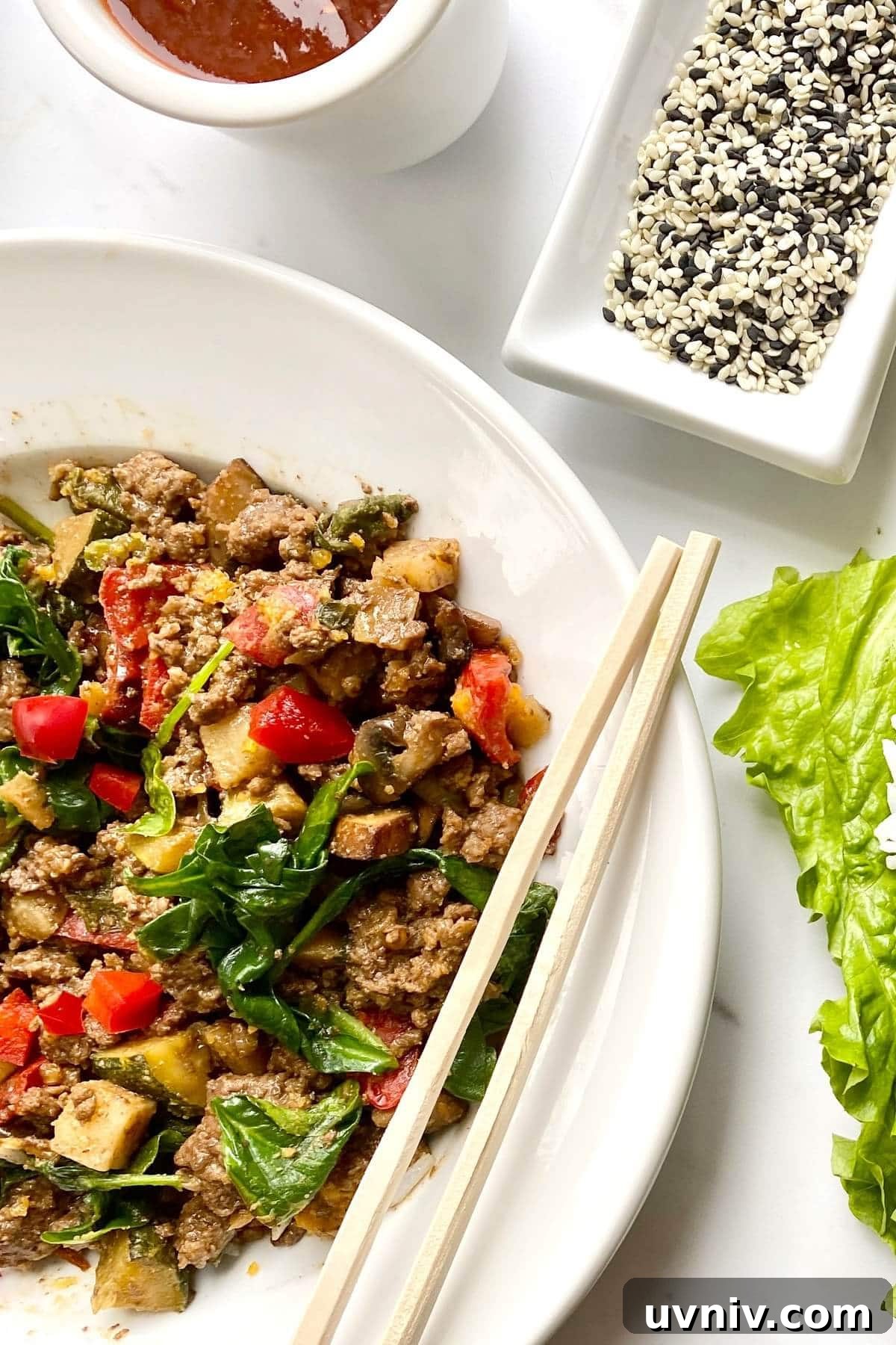 Savory Ground Beef Lettuce Wraps with Zesty Asian Sauce 3 filling for Korean beef lettuce wraps and sesame seeds.