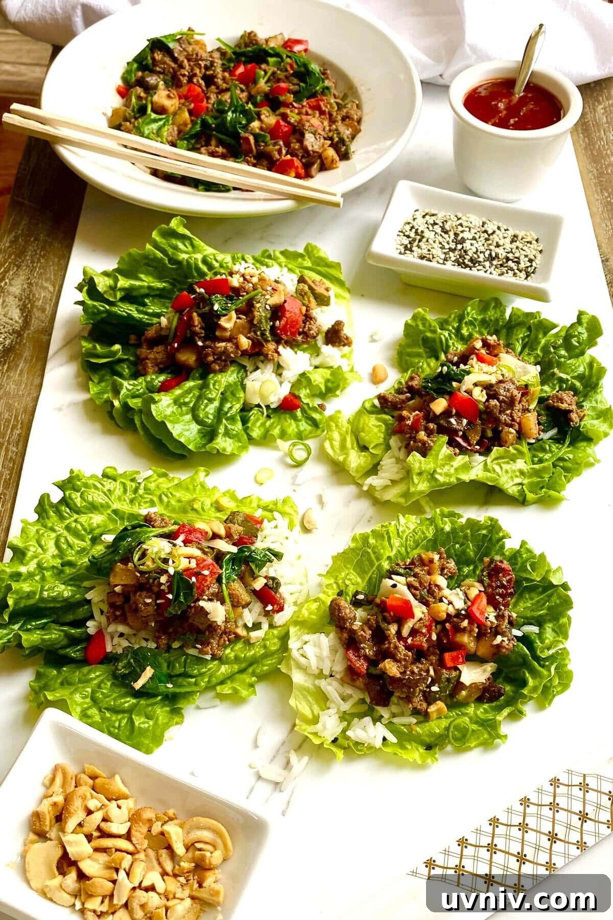 Savory Ground Beef Lettuce Wraps with Zesty Asian Sauce 5 4 Korean beef lettuce wraps and sesame seeds.