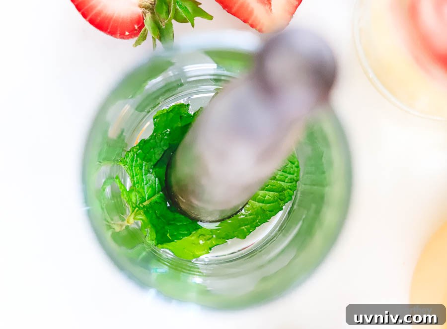 Peach and Strawberry Rum Mojito Recipe for Summer Cocktails 5 Muddling Mint