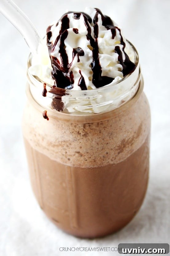 Homemade Mocha Frappuccino Copycat Recipe - just a few ingredients and 2 minutes is all you need to make this cooling coffee drink in your own kitchen!