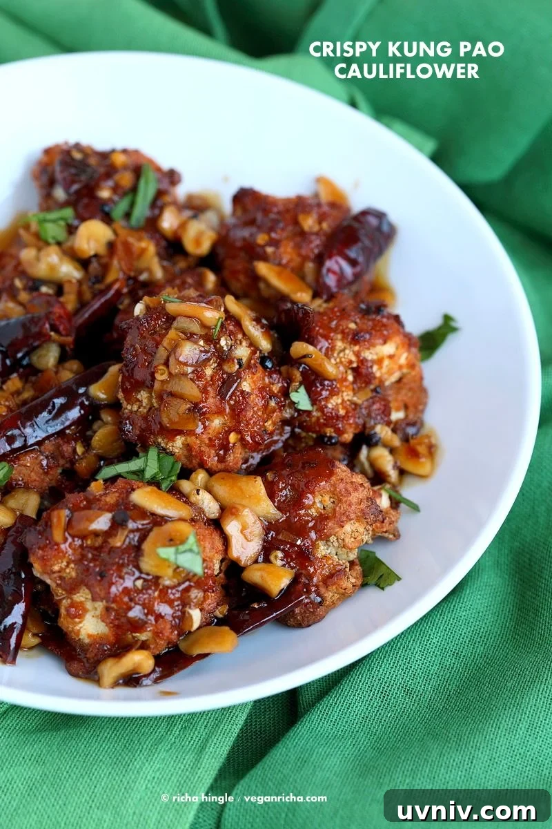 Crispy Spicy Kung Pao Cauliflower Recipe for Dinner 2 Crispy Kung Pao Cauliflower. Cauliflower battered and baked and tossed in spicy kung pao sauce.