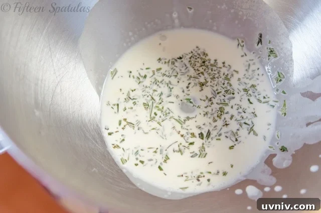 Heavy Cream in Mixing Bowl with Herbs