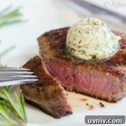Rare Cooked Steak Cut and Served with Whipped Garlic Herb Butter On Top