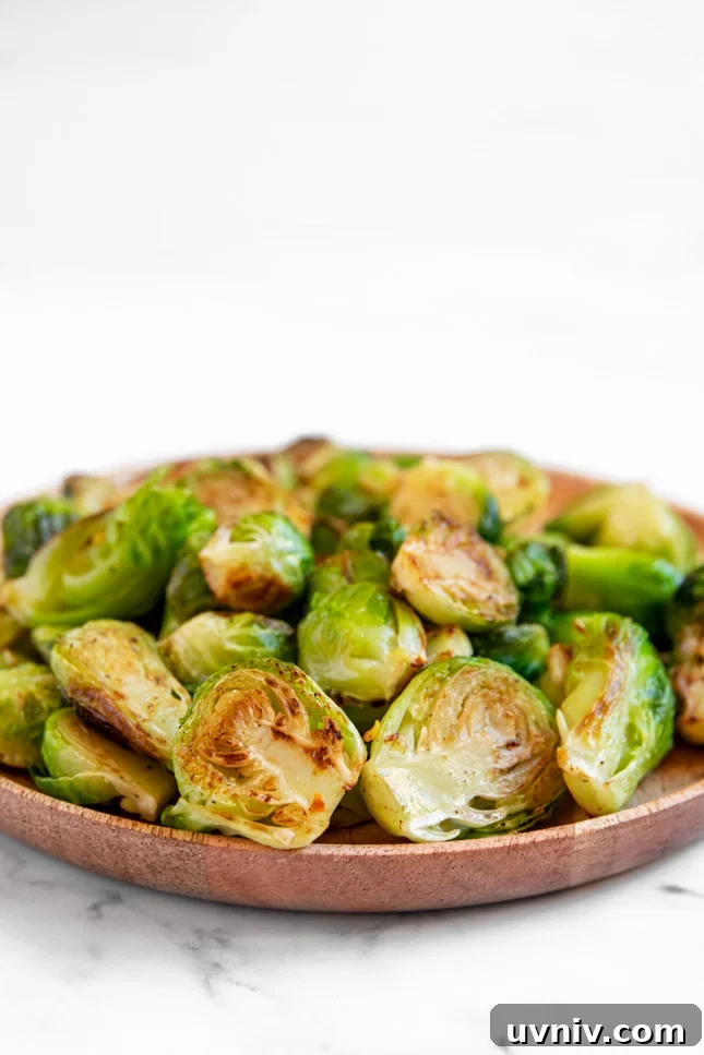 Crispy Sautéed Brussels Sprouts with Garlic and Parmesan 5 Side shot of a plate of sauteed Brussels sprouts