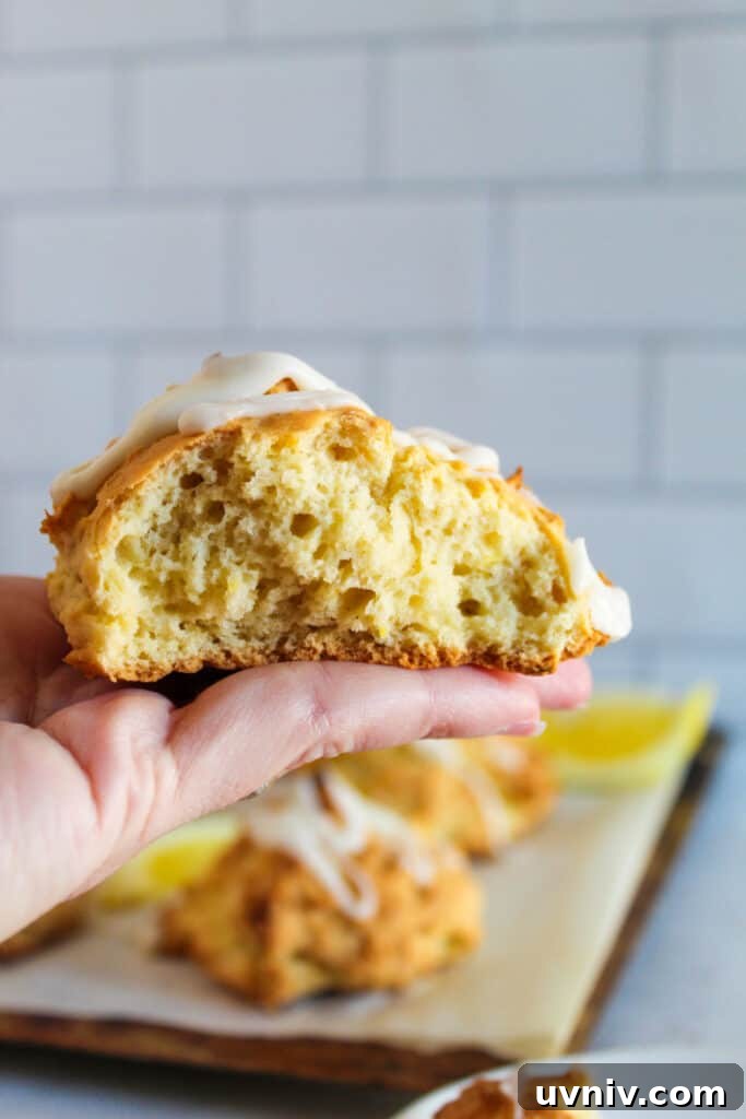 Gluten-Free Lemon Scones Recipe — Light, Zesty, Quick to Make 3 hand holding a lemonade scone