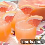 grapefruit mimosas in stemless glasses