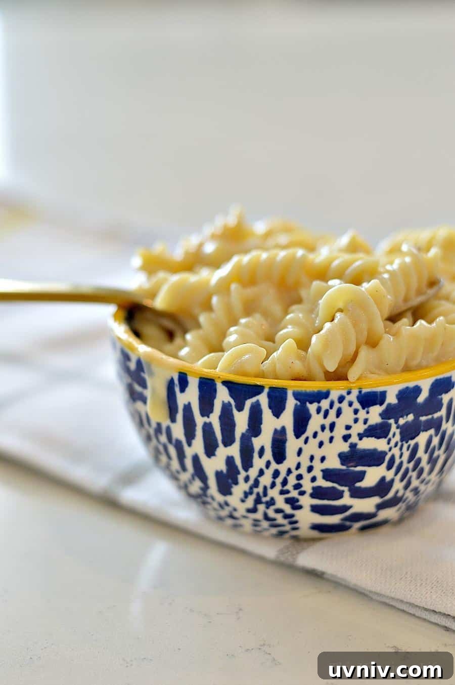 Gluten-free mac and cheese (Instant Pot) Gluten-Free Mac and cheese in a blue spotted bowl