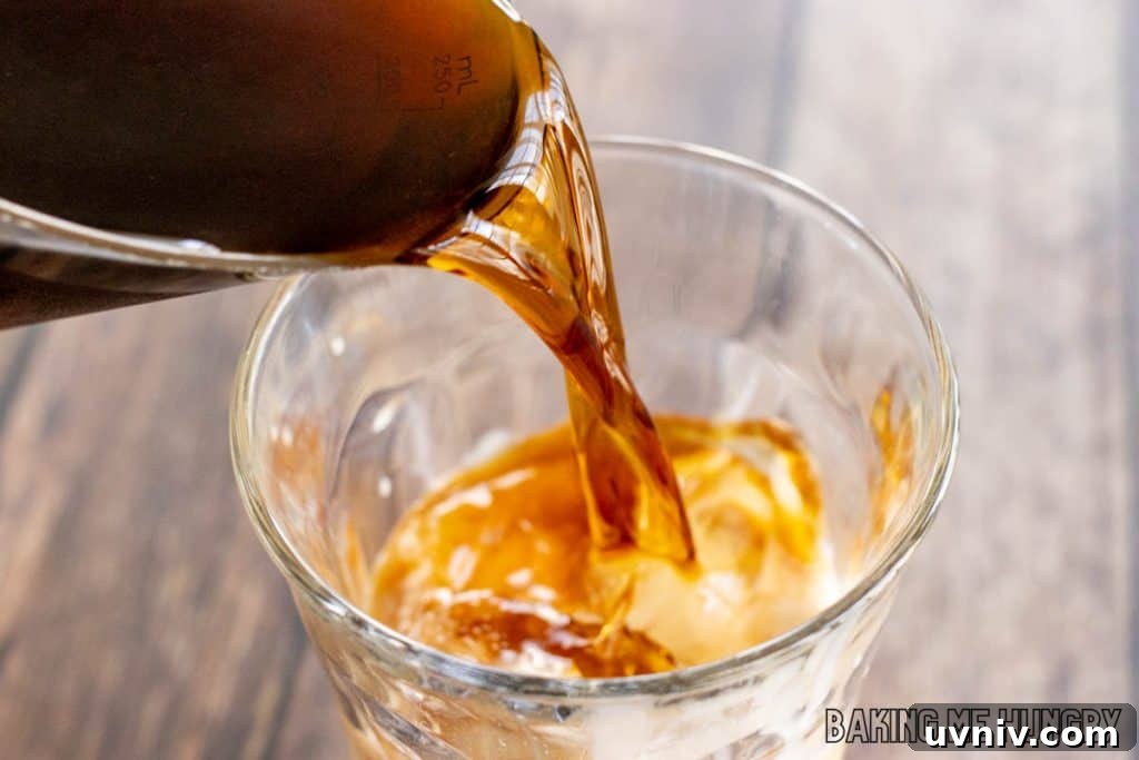 Creamy Caramel Iced Coffee Recipe You’ll Love 6 coffee being added