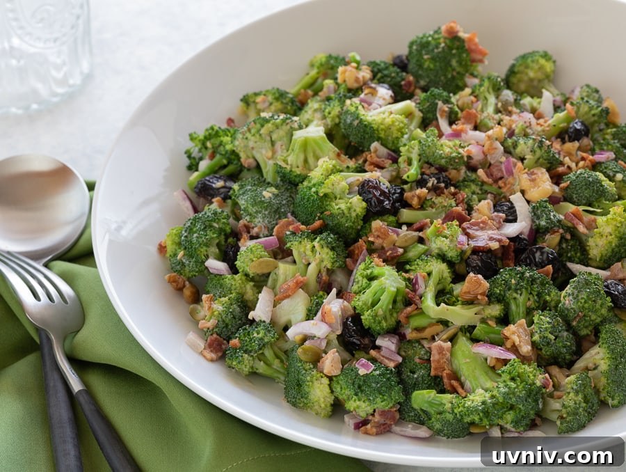 Broccoli Bacon Salad in a white bowl for serving.