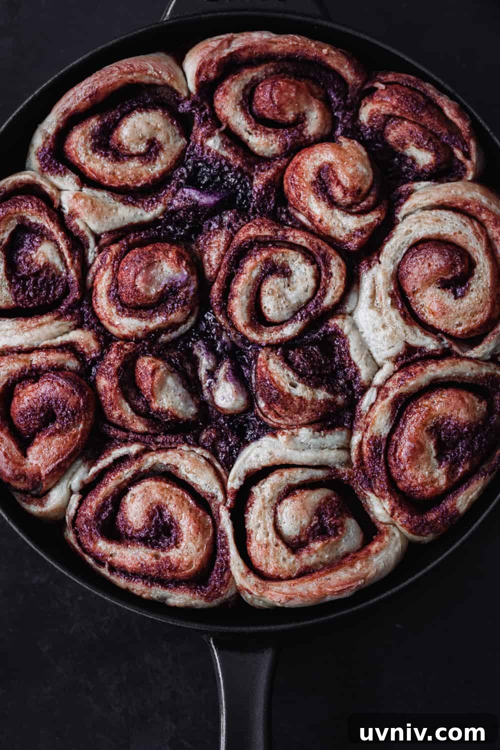 Cinnamon Rolls Made with Fluffy Challah Dough 4 Post oven and pre-icing overhead shot of cinnamon rolls just out of the oven.