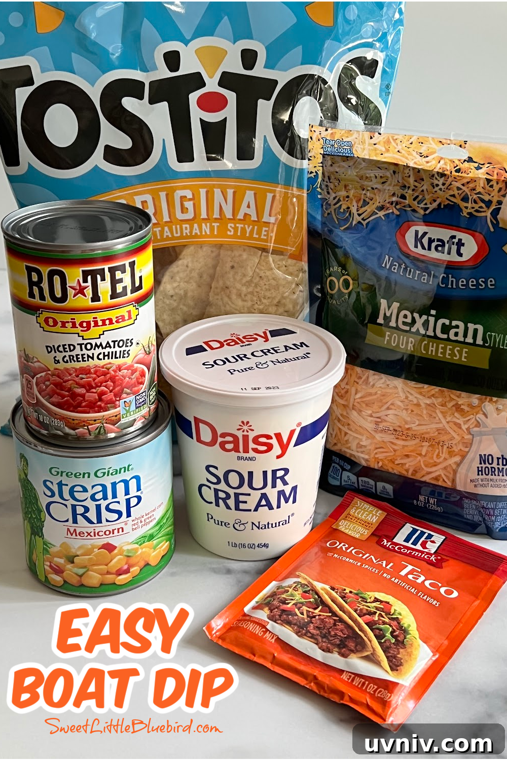 5-Ingredient Party Boat Dip Recipe for Quick Entertaining 3 This photo shows all the ingredients needed to make boat dip. Sour cream, Mexican-Style four cheese blend, taco seasoning, Mexicorn and Rotel.