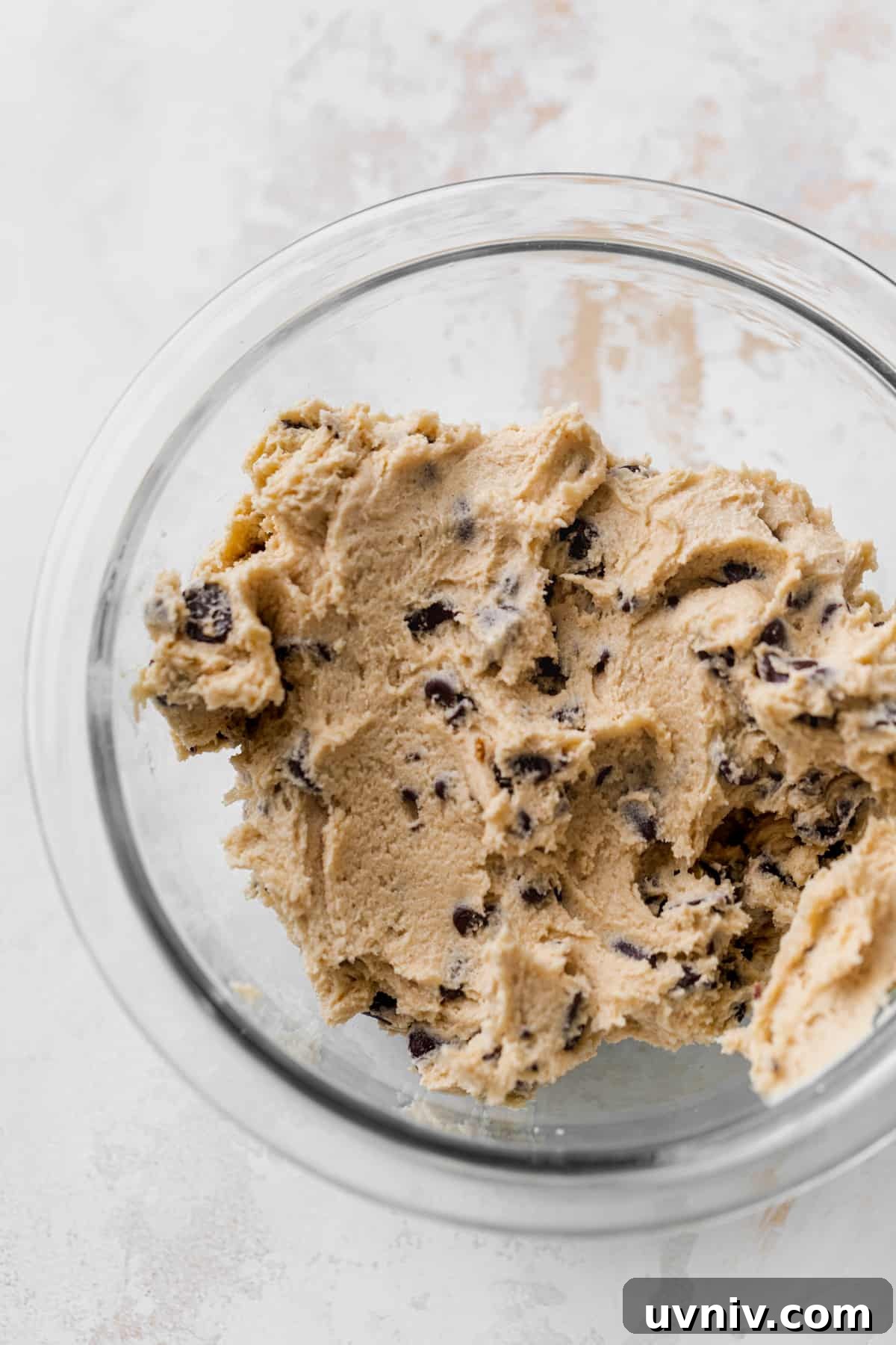Cookie Dough Cheesecake Bars Recipe — No-Bake Dessert Bars 5 Cookie dough in glass bowl.