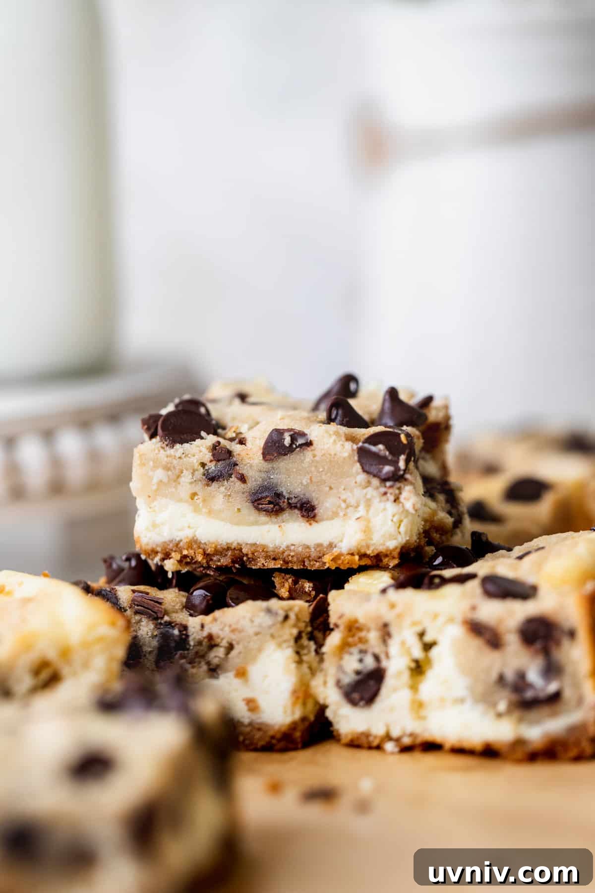 Cookie Dough Cheesecake Bars Recipe — No-Bake Dessert Bars 10 Stack of three bars.