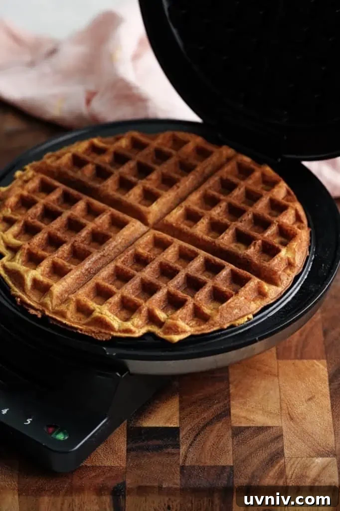 Buttermilk Pumpkin Spice Waffles Recipe for Fall Breakfast 5 buttermilk pumpkin spice waffles in waffle maker.