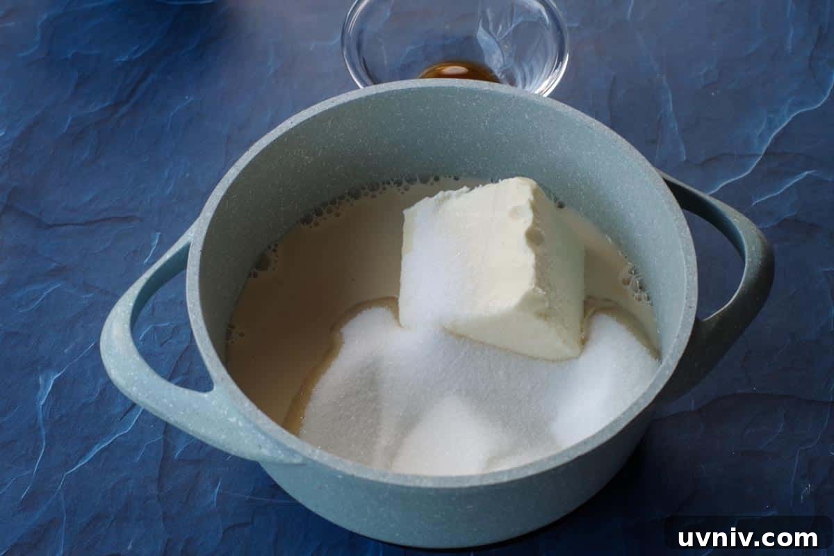 Root Beer Float Fudge Recipe: Creamy Soda-Infused Candy 7 sugar milk and butter in a light blue saucepan