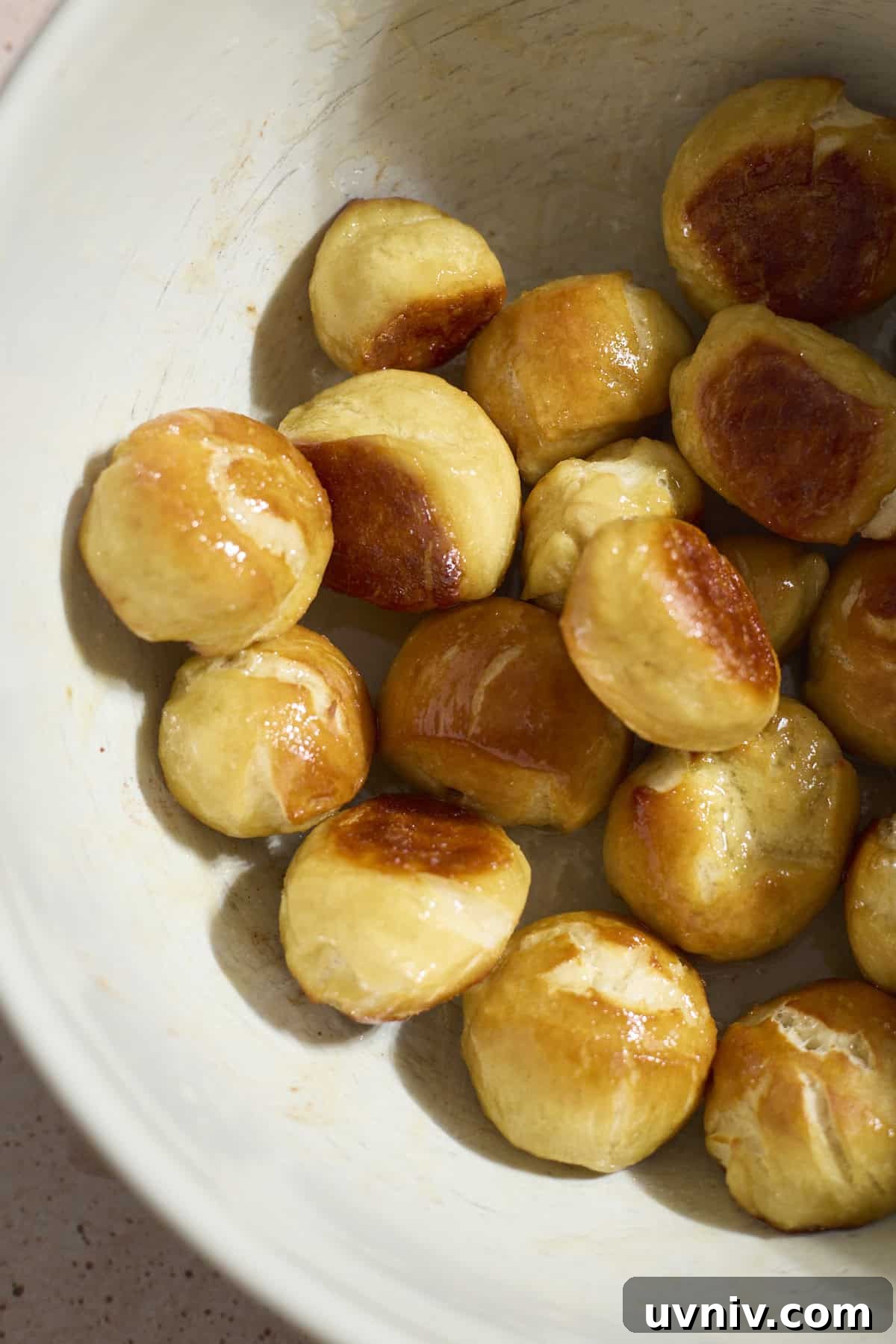 Pretzel bites tossed in butter.