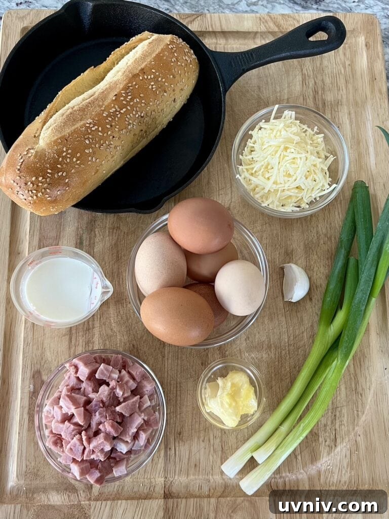 All ingredients for easy ham and cheese frittata on cutting board.
