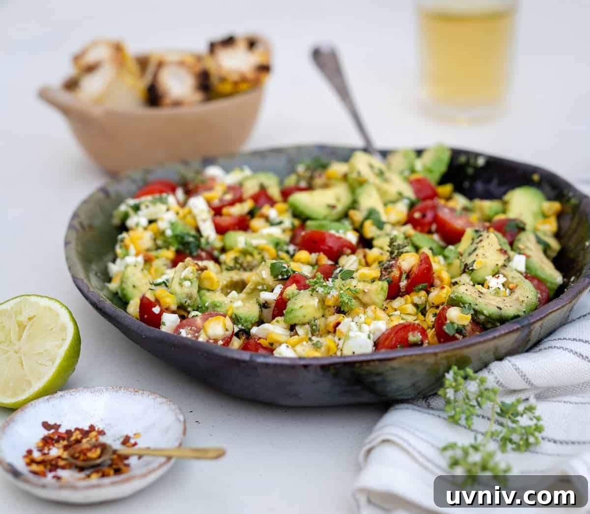 Grilled Corn and Avocado Salad with Lime Cilantro Dressing 7 Grilled corn and avocado salad in a bowl