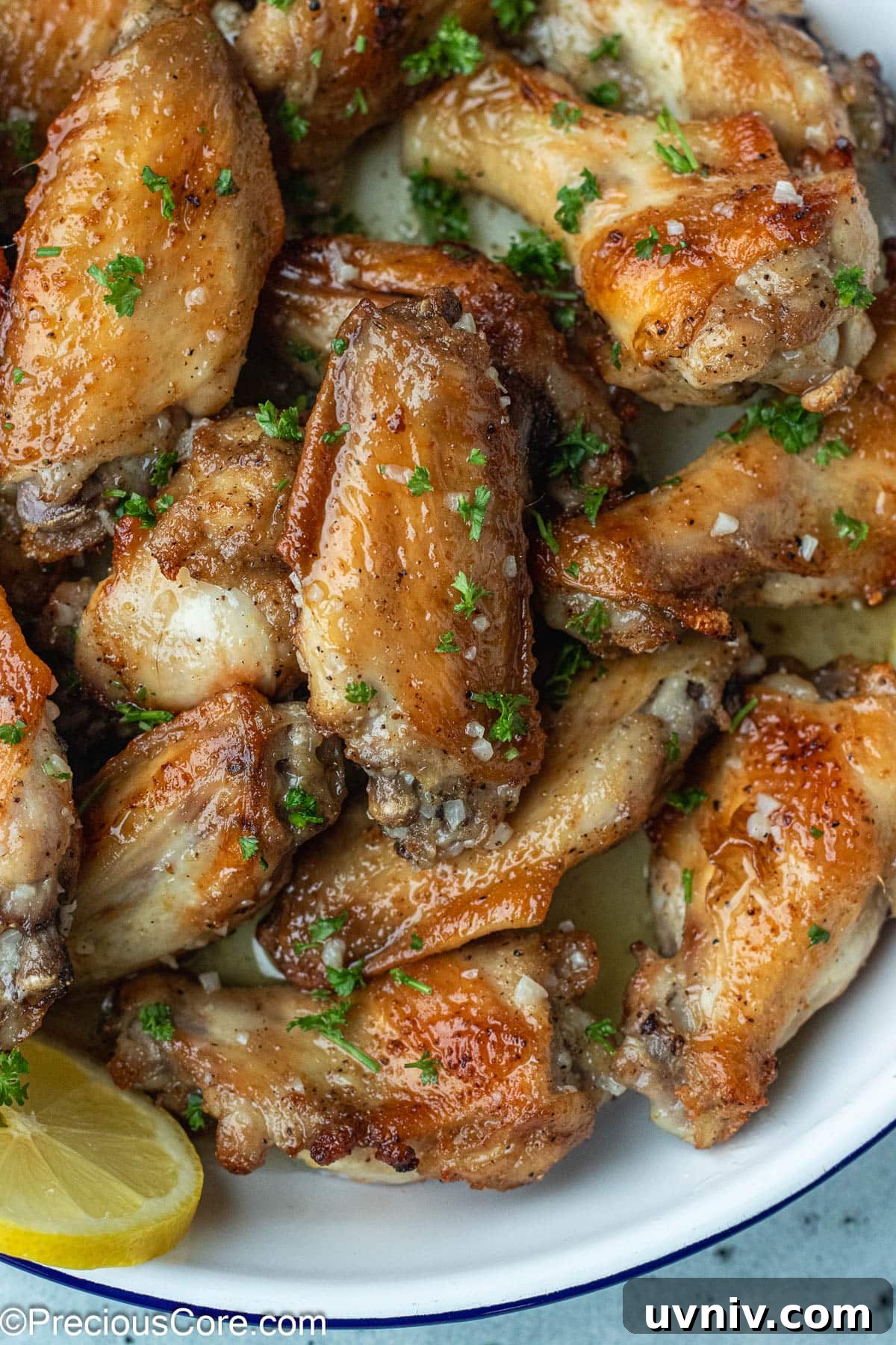 Crispy Garlic Butter Chicken Wings Recipe 4 Bowl of chicken wings with garlic butter at the bottom.