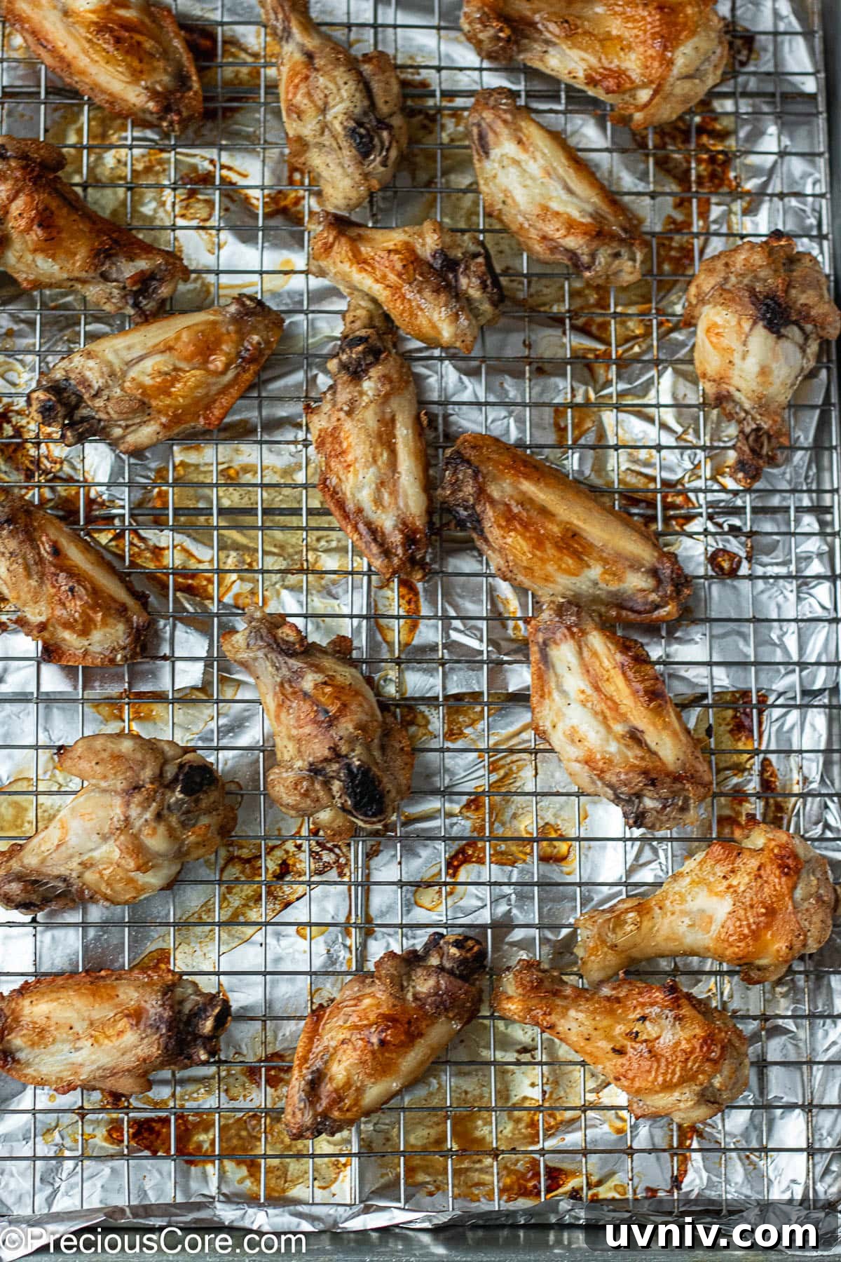 Crispy Garlic Butter Chicken Wings Recipe 7 Baked chicken wings on a baking rack.