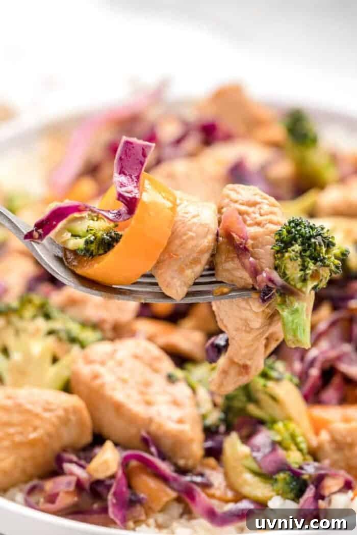 Low-Carb White Chicken Chili Recipe for Keto Diet 15 keto stir fry with chicken and vegetables on a fork