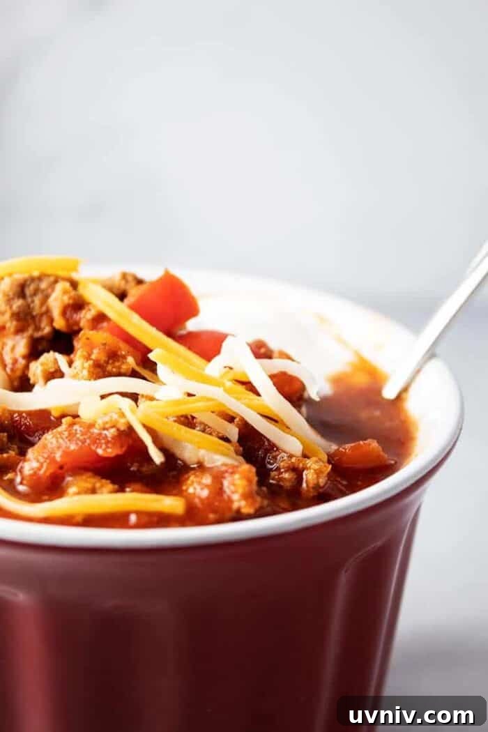 Low-Carb White Chicken Chili Recipe for Keto Diet 6 side of red bowl containing low carb turkey chili