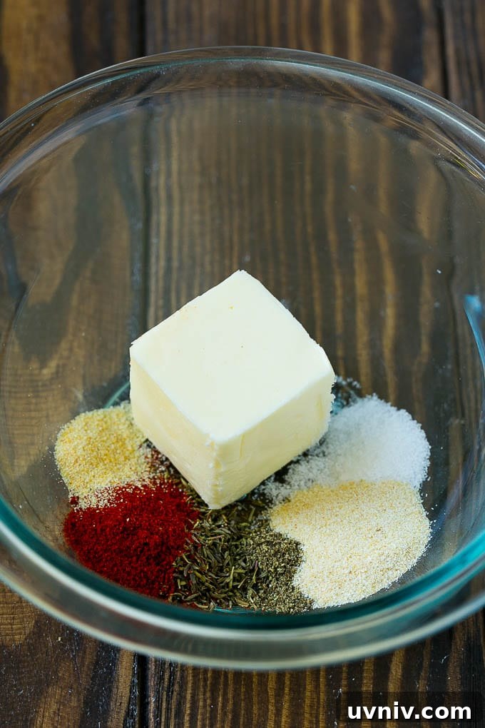 Butter and seasonings in a mixing bowl.