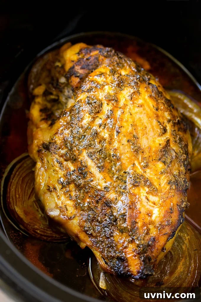 Cooked meat inside a crock pot.