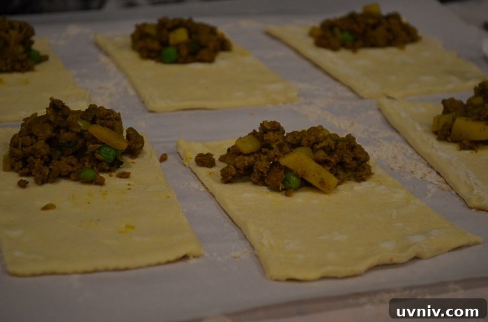 Crispy Beef Samosa Puff Pastries — Savory Indian Snack Recipe 19 place meat in middle