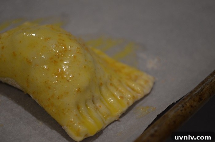 Crispy Beef Samosa Puff Pastries — Savory Indian Snack Recipe 24 cover completely in egg wash
