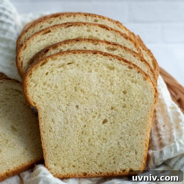 Sourdough Starter Ratios: How to Mix for Consistent Results 9 Slices of soft sourdough sandwich bread sitting together in a basket.
