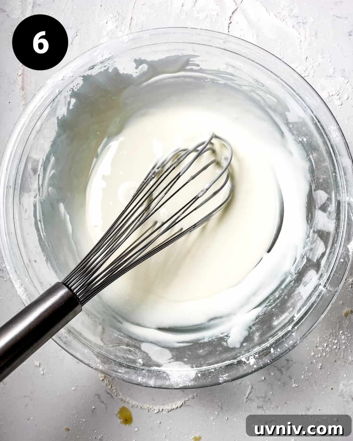 How to Make Perfect Snowflake Sugar Cookies for Winter Parties 9 royal icing whisked together in a mixing bowl.