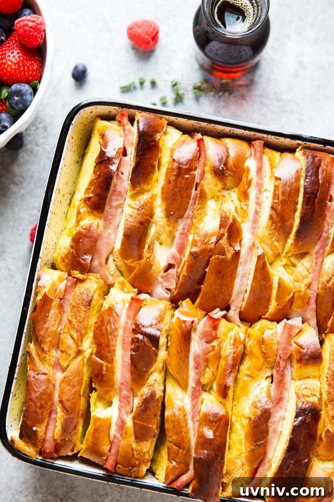 Ham and Cheese Breakfast Casserole Recipe for Brunch and Meal Prep 7 Ham and Cheese Breakfast Casserole served with warm syrup and a side of berries!
