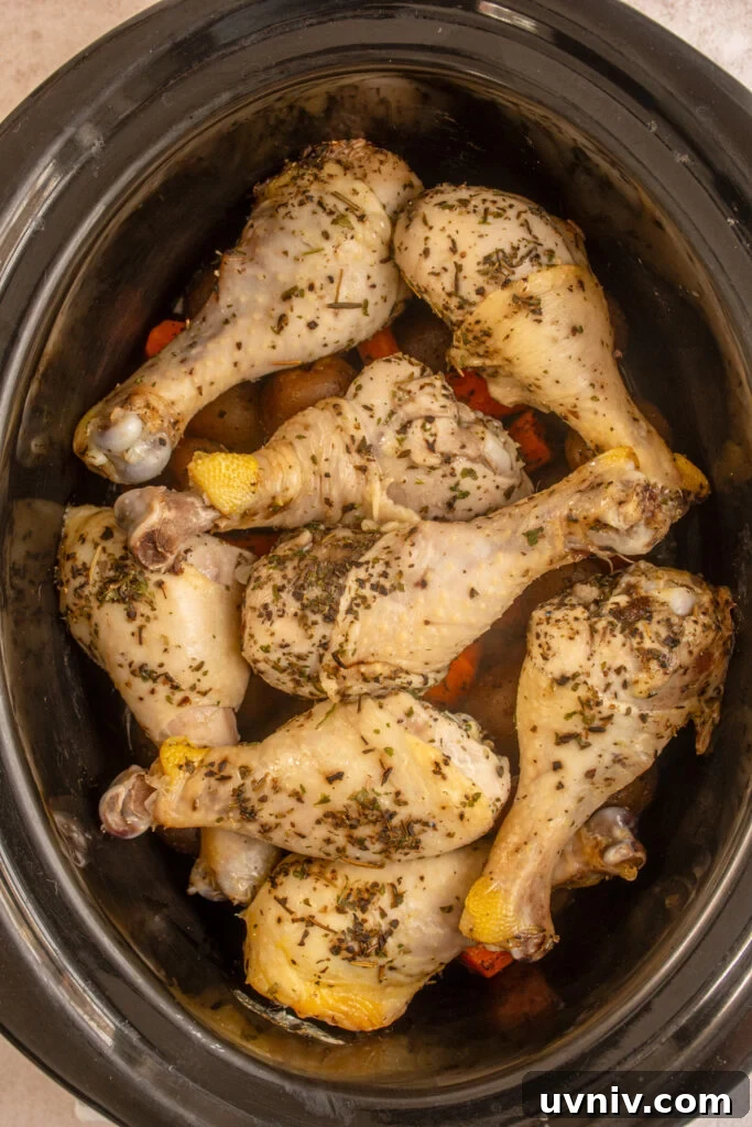 Slow Cooker Chicken Legs with Crispy Potatoes Recipe 9 The slow cooker done cooking the chicken legs and vegetables.