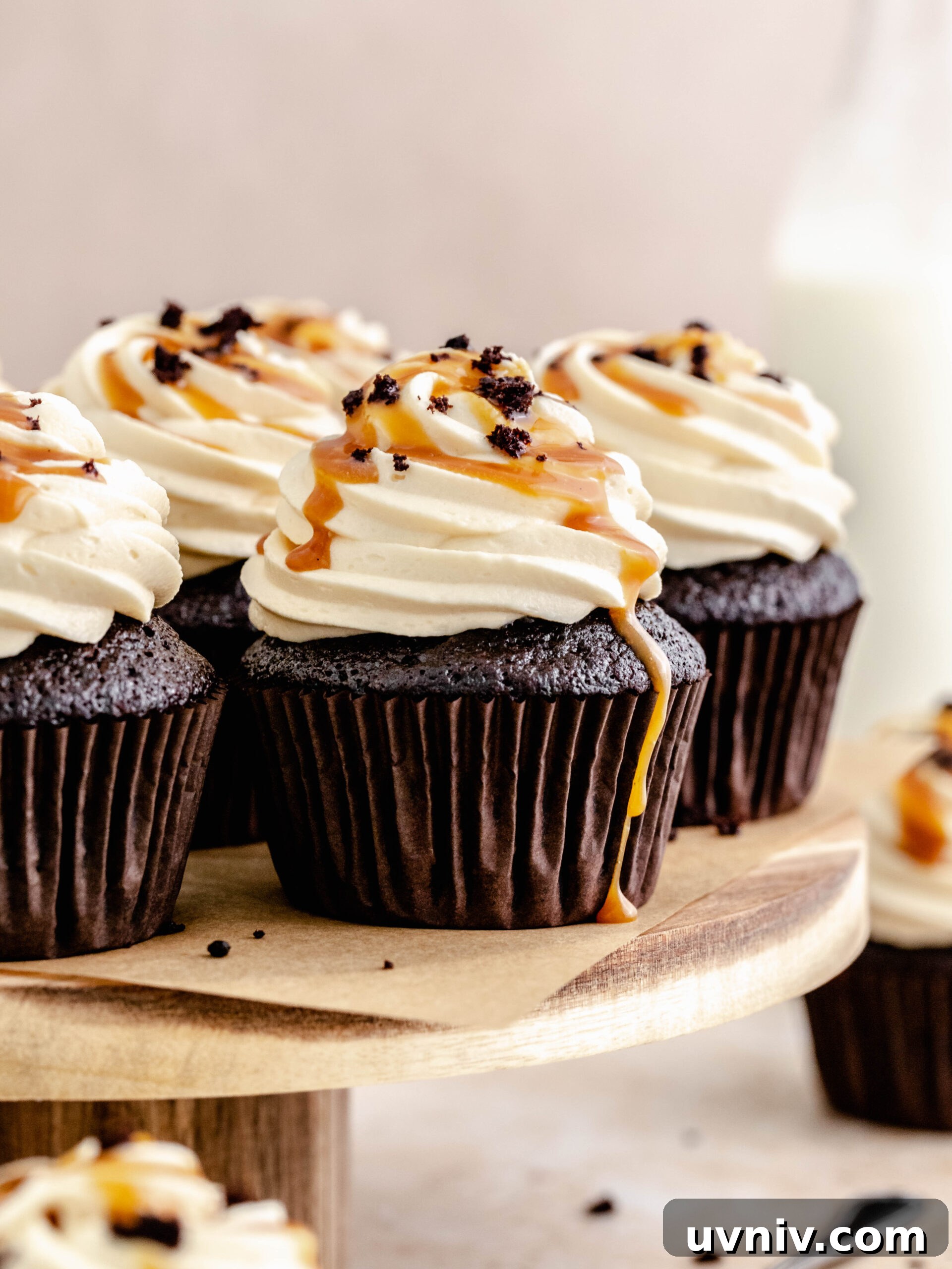 caramel filled cupcakes on a cake stand.