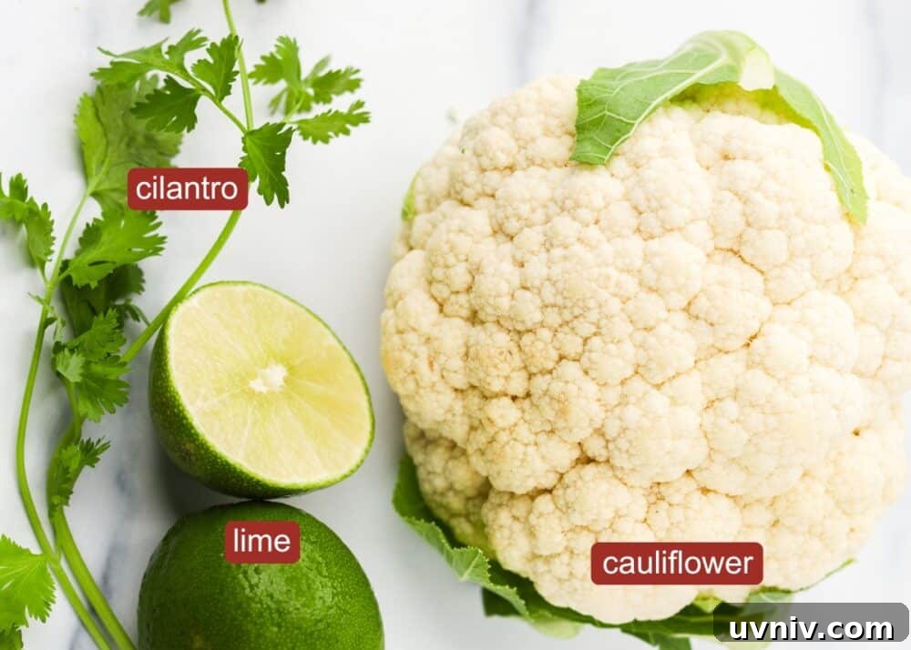 ingredients for cauliflower rice including lime, cilantro, and a head of cauliflower