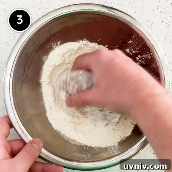 Coating a Japanese menchi pattie with flour