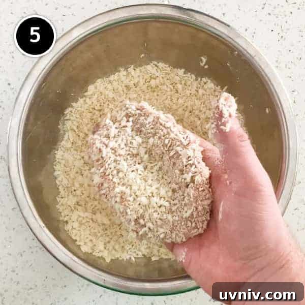 Coating a Japanese menchi pattie with pank breadcrumbs