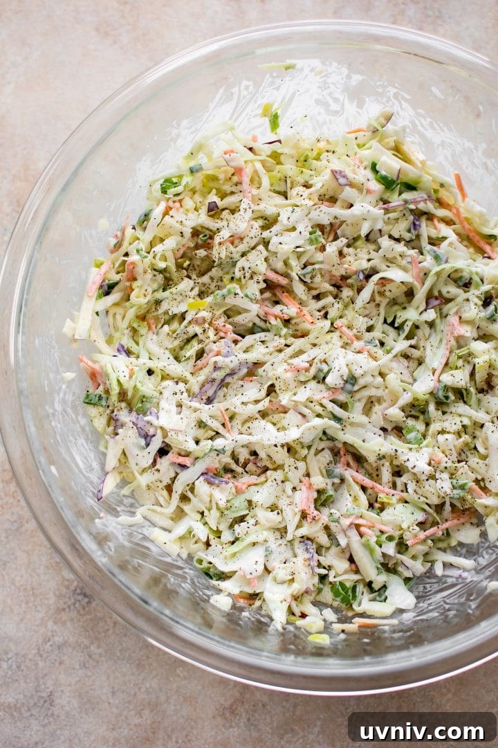 Crisp Apple Slaw Recipe with Tangy Honey-Mustard Dressing 3 apple slaw in a glass serving bowl