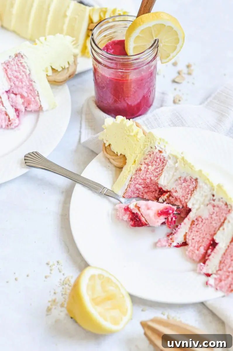 Pink Lemonade Cake Recipe: Light, Refreshing Layer Cake 5 A slice of pink lemonade cake filled with raspberry curd filling and frosted in a yellow lemon buttercream.